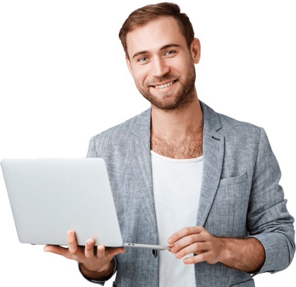 A smiling man holding a laptop.